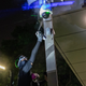 A pro-democracy protester sprays paint over a CCTV camera outside the Central Government Complex on September 28, 2019 in Hong Kong